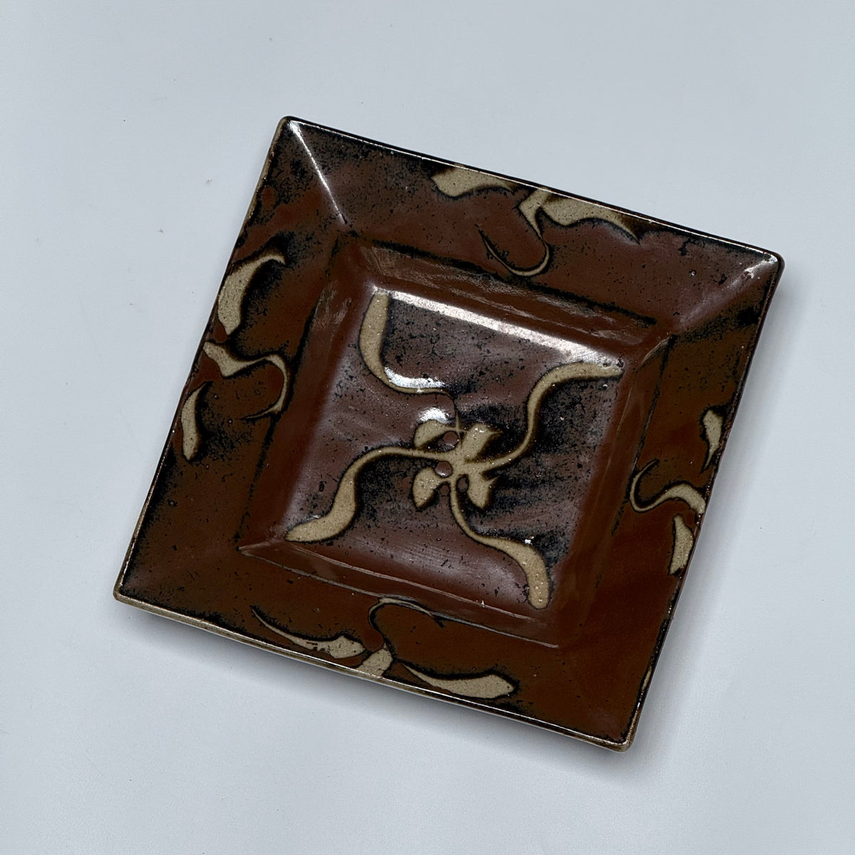Shoji Hamada square stoneware dish with kaki glaze and wax-resist floral design, view 12 of 12