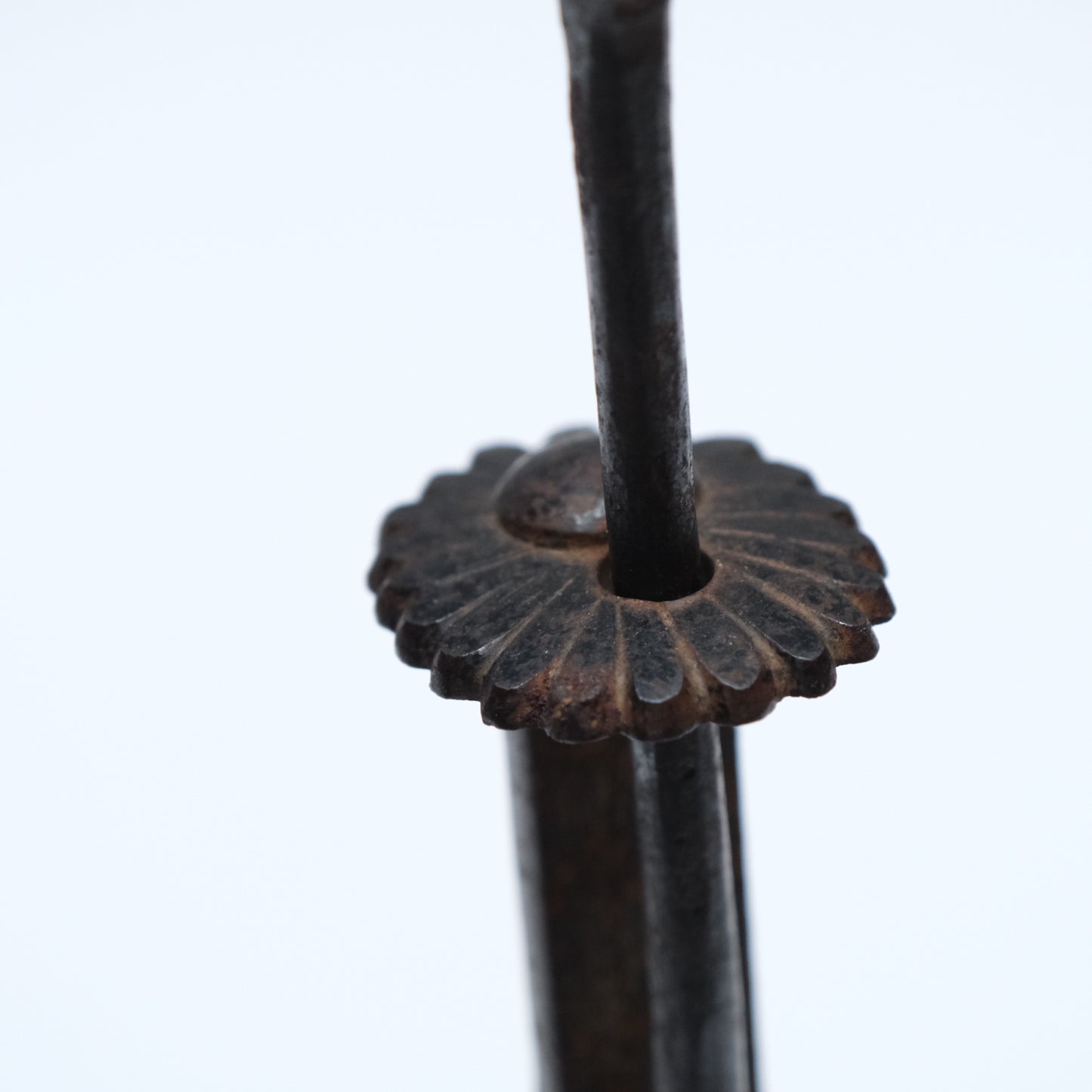 Close-up of iron surface patina on Japanese chrysanthemum motif tansu lock