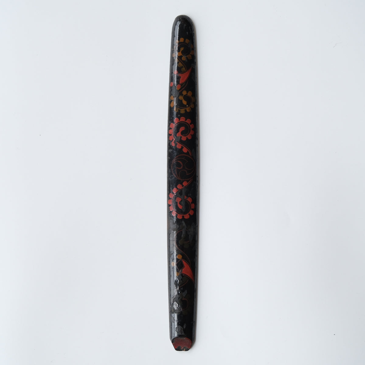 Ainu ikupasuy prayer stick in black lacquer painted with scrolling stems, red commas and gold rosettes, view 1 of 12