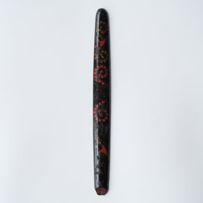 Ainu ikupasuy prayer stick in black lacquer painted with scrolling stems, red commas and gold rosettes, view 1 of 12