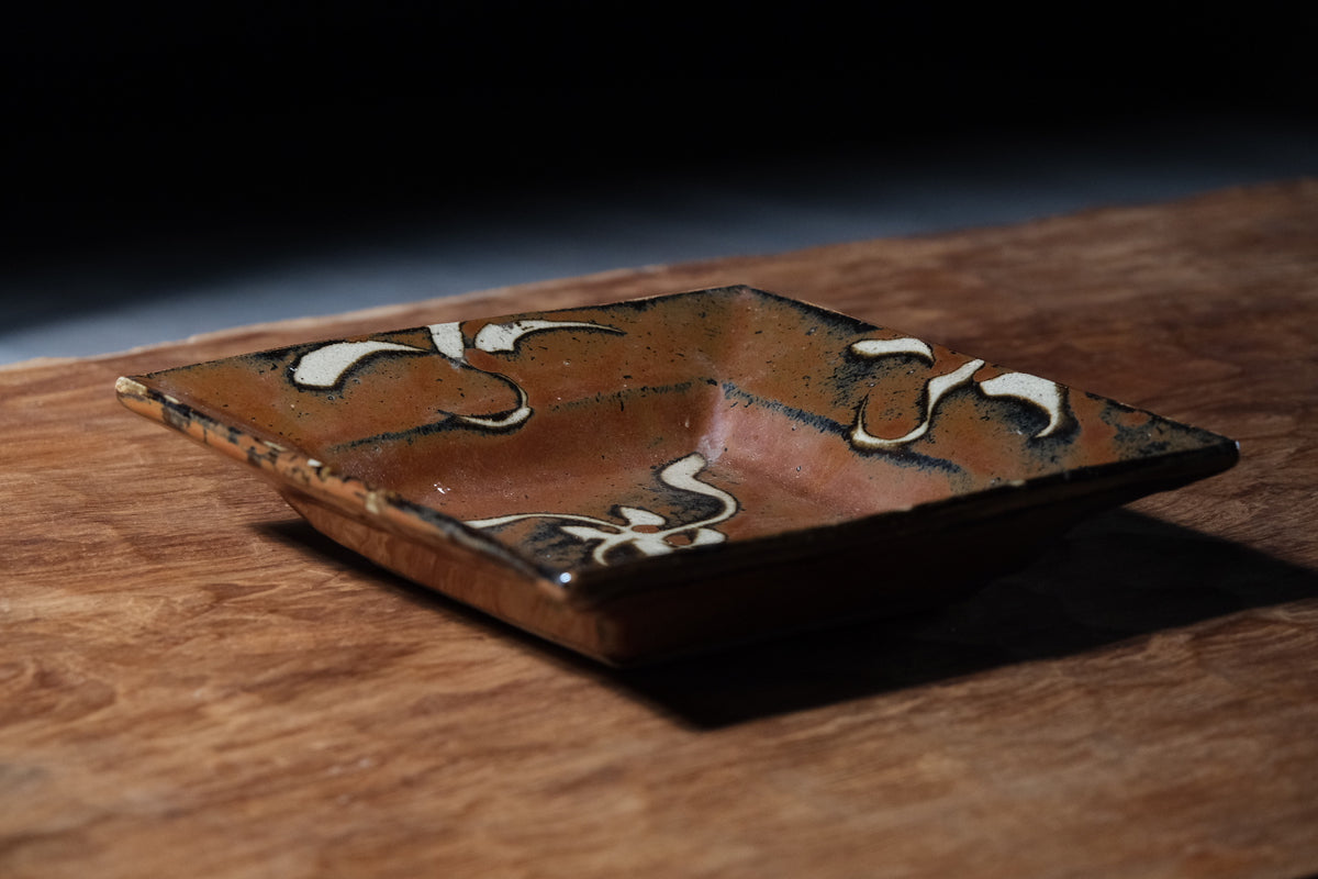 Shoji Hamada square stoneware dish with kaki glaze and wax-resist floral design, view 3 of 12