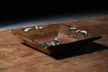 Shoji Hamada square stoneware dish with kaki glaze and wax-resist floral design, view 3 of 12
