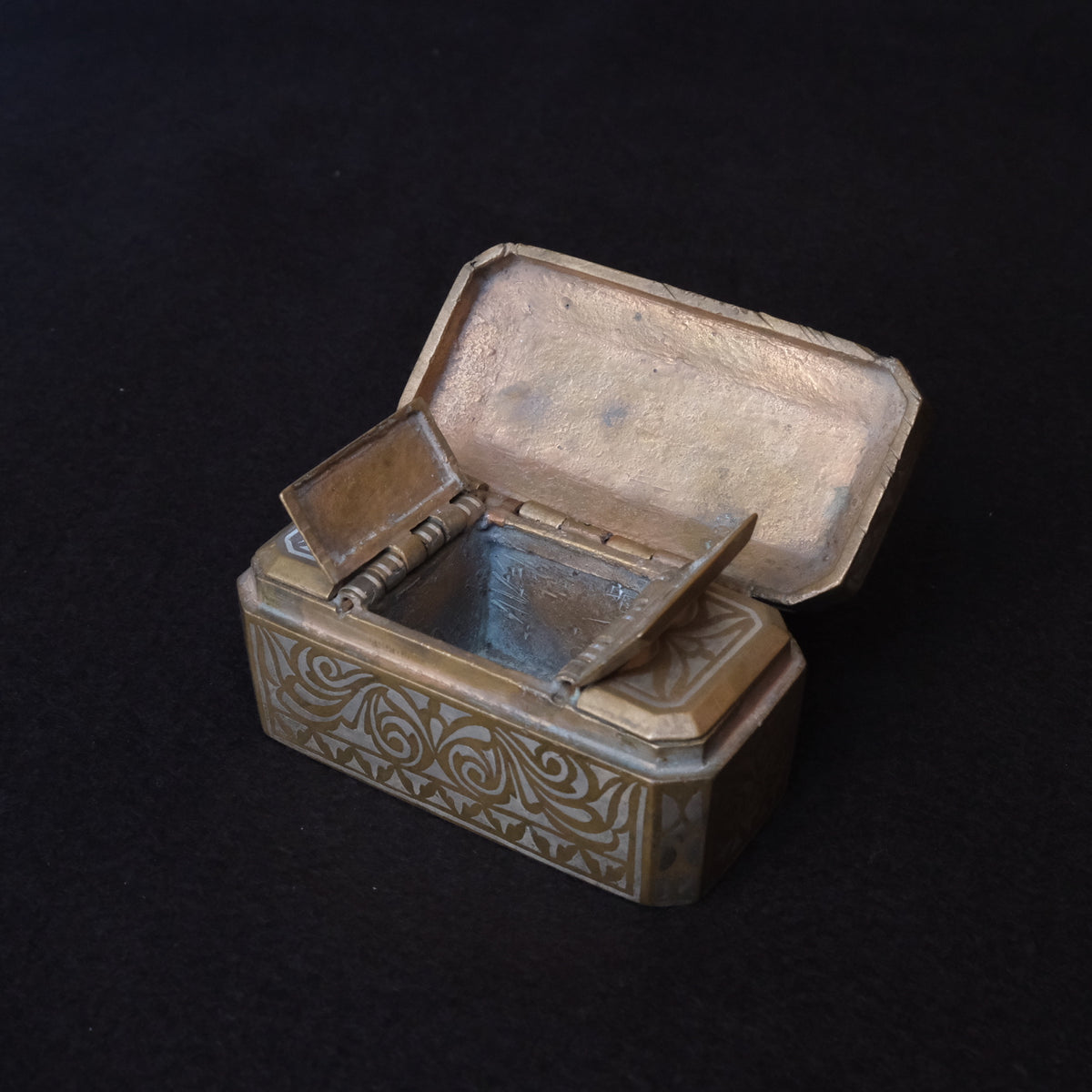 Maranao brass betel nut box engraved with silver-inlaid okir scrollwork, view 7 of 10