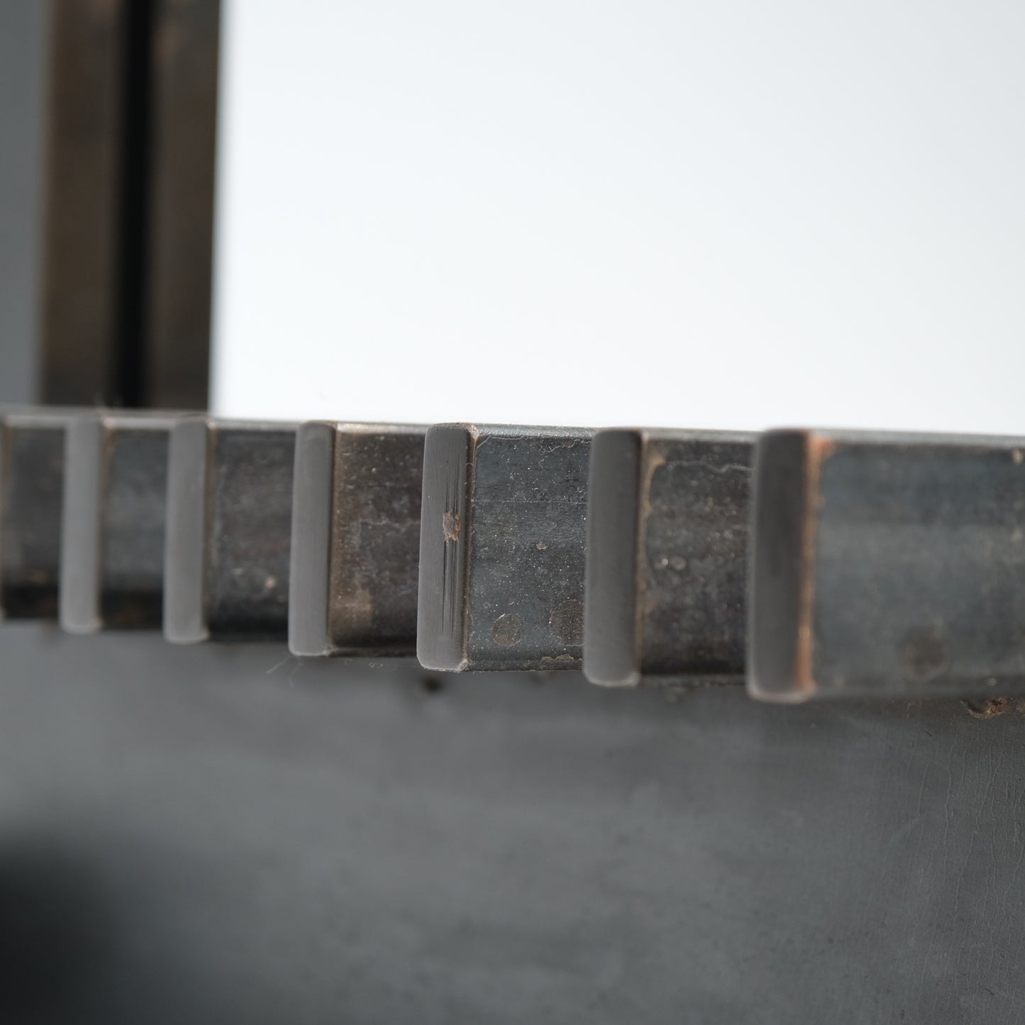 Bronze log detail showing surface texture and color