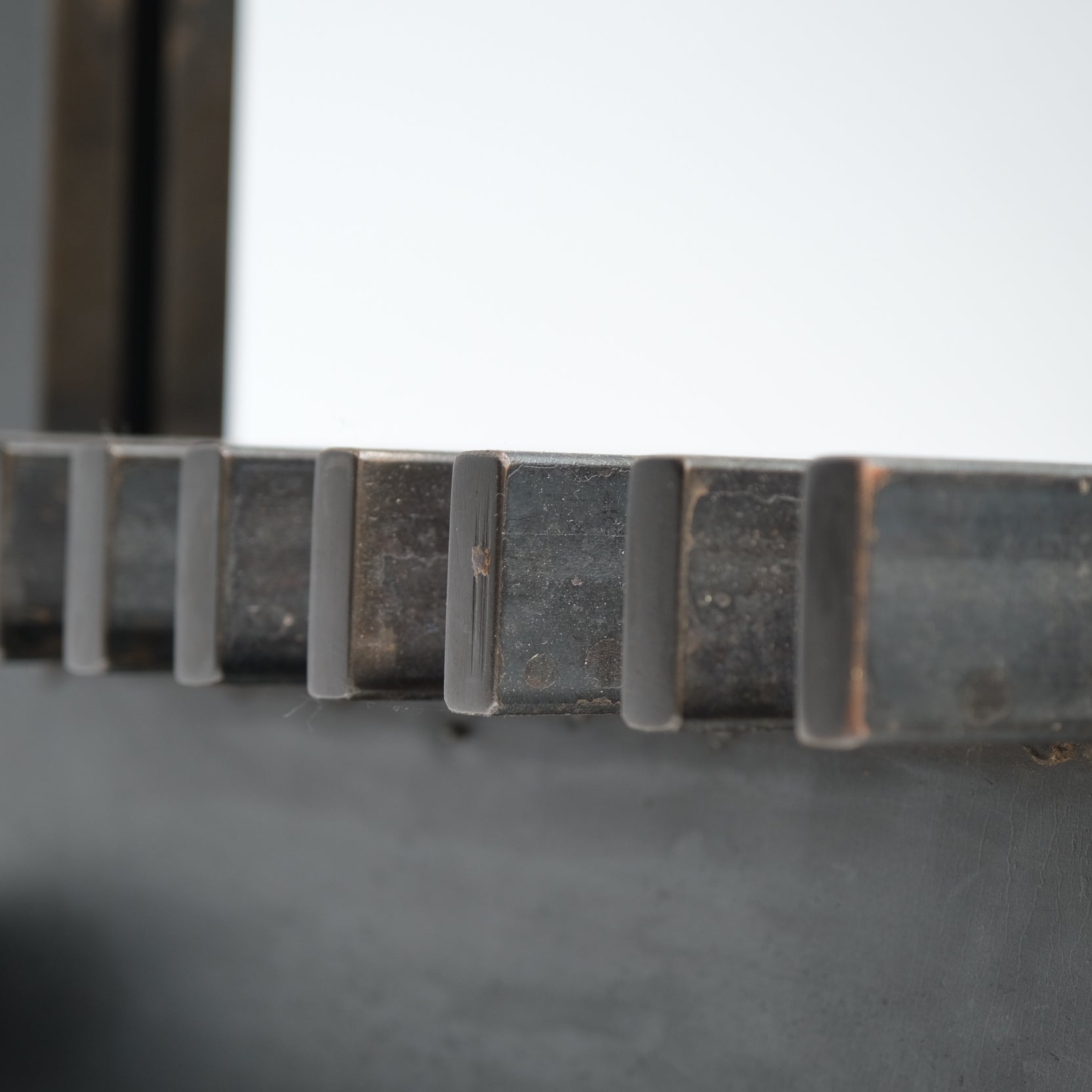 Bronze log detail showing surface texture and color