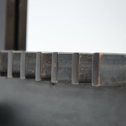 Bronze log detail showing surface texture and color