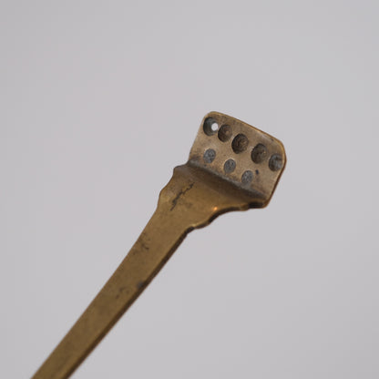 Pair of Japanese metal pill forms together showing scale and construction