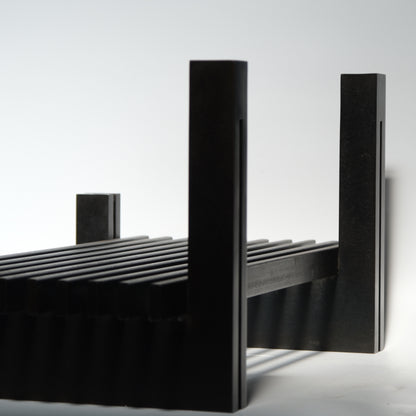 Bronze logs three-quarter view showing sculptural quality