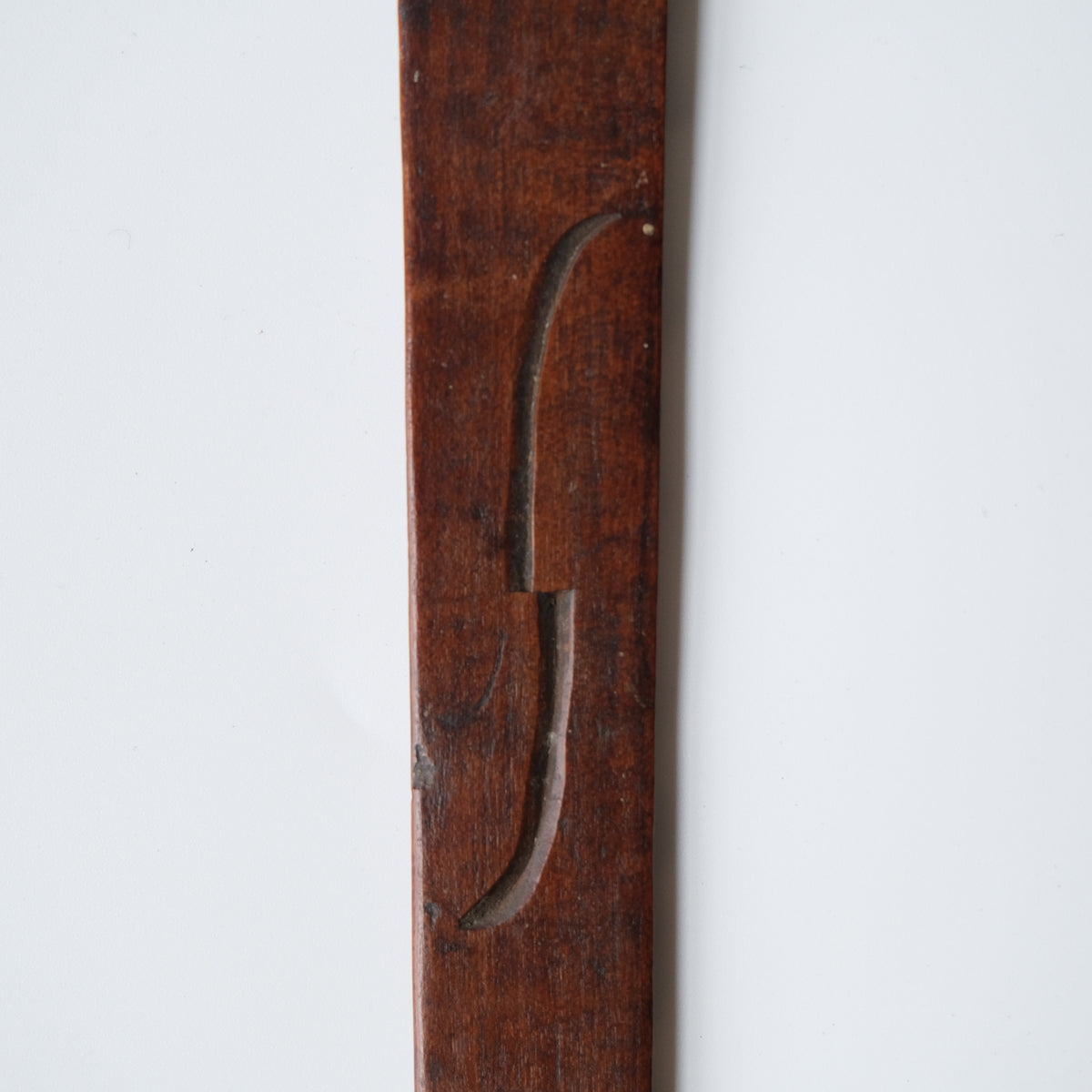 Ainu ikupasuy prayer stick carved in low relief with blade forms and a ringed boss, view 8 of 9