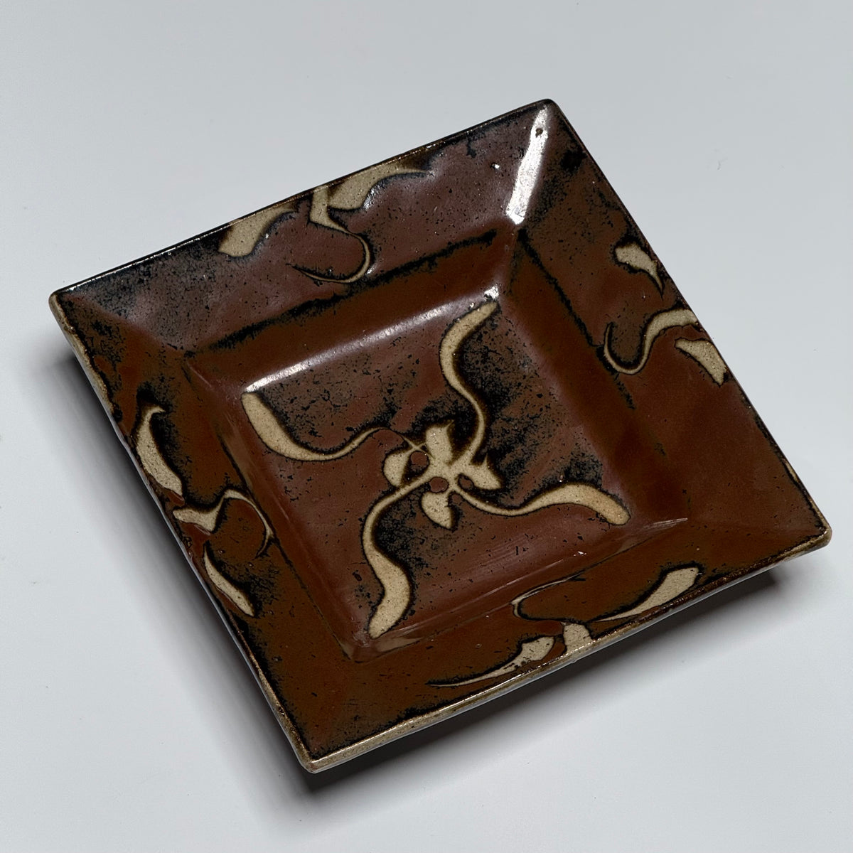 Shoji Hamada square stoneware dish with kaki glaze and wax-resist floral design, view 8 of 12