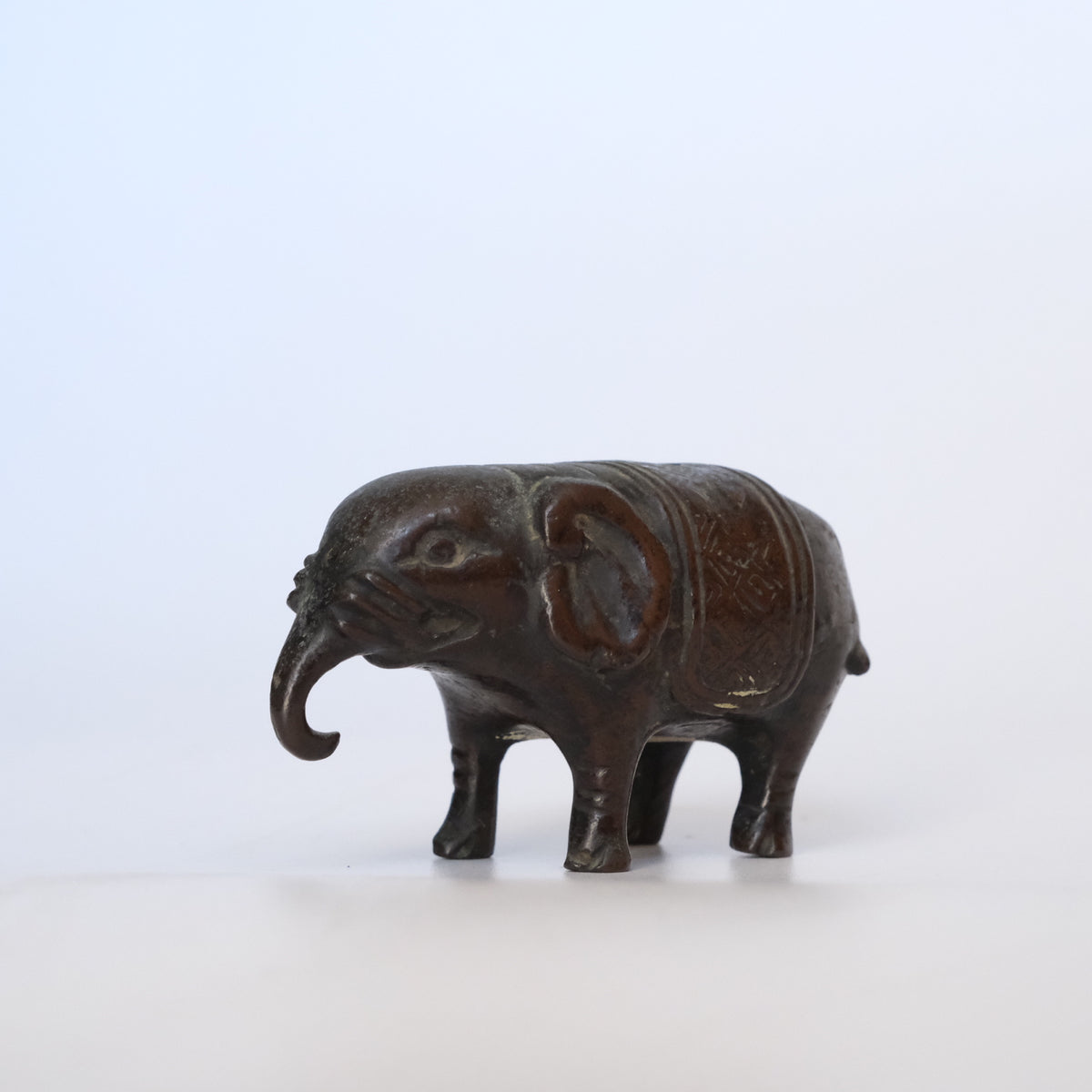 Small cast bronze elephant water dropper (suiteki) with incised caparison, view 7 of 8