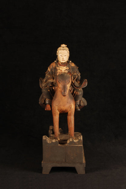 Three-quarter view of Shinto Inari god riding fox, Buddhist-Shinto syncretism