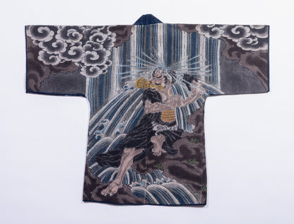 Spread view of sashiko hanten jacket showing full stitched pattern coverage