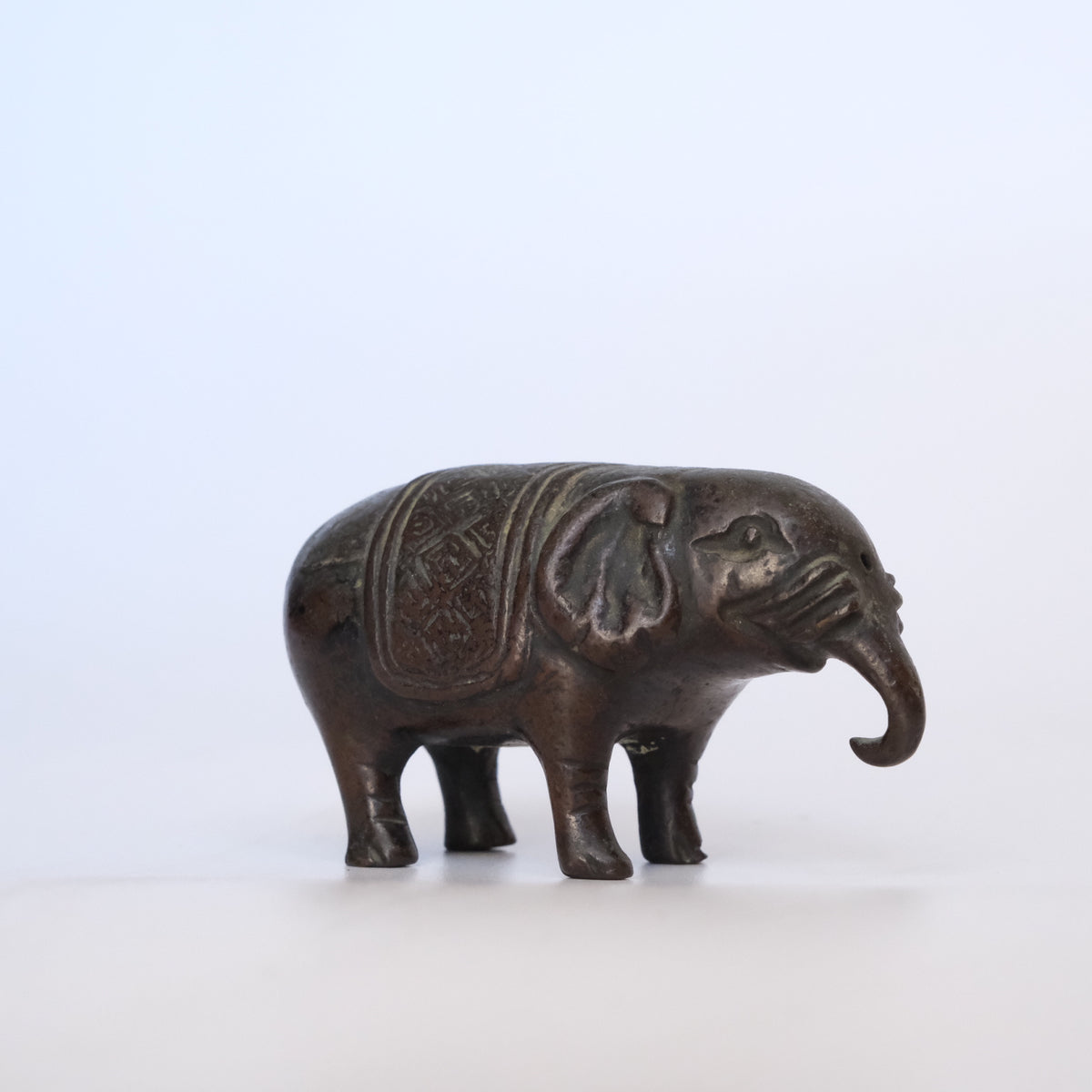 Small cast bronze elephant water dropper (suiteki) with incised caparison, view 5 of 8