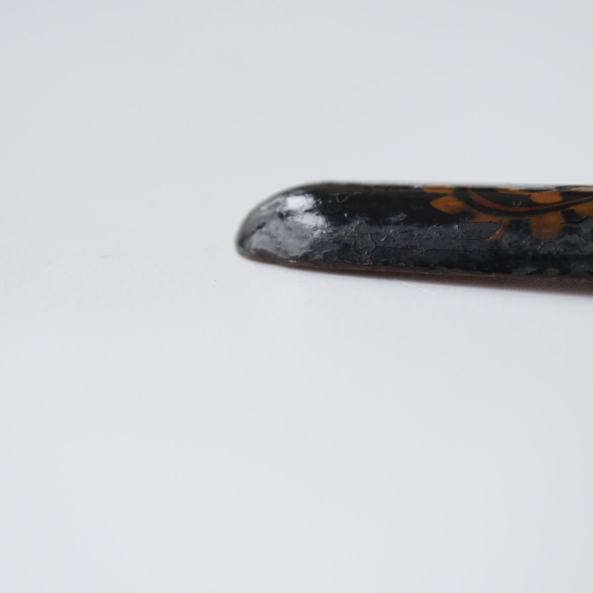 Ainu ikupasuy prayer stick in black lacquer painted with scrolling stems, red commas and gold rosettes, view 8 of 12