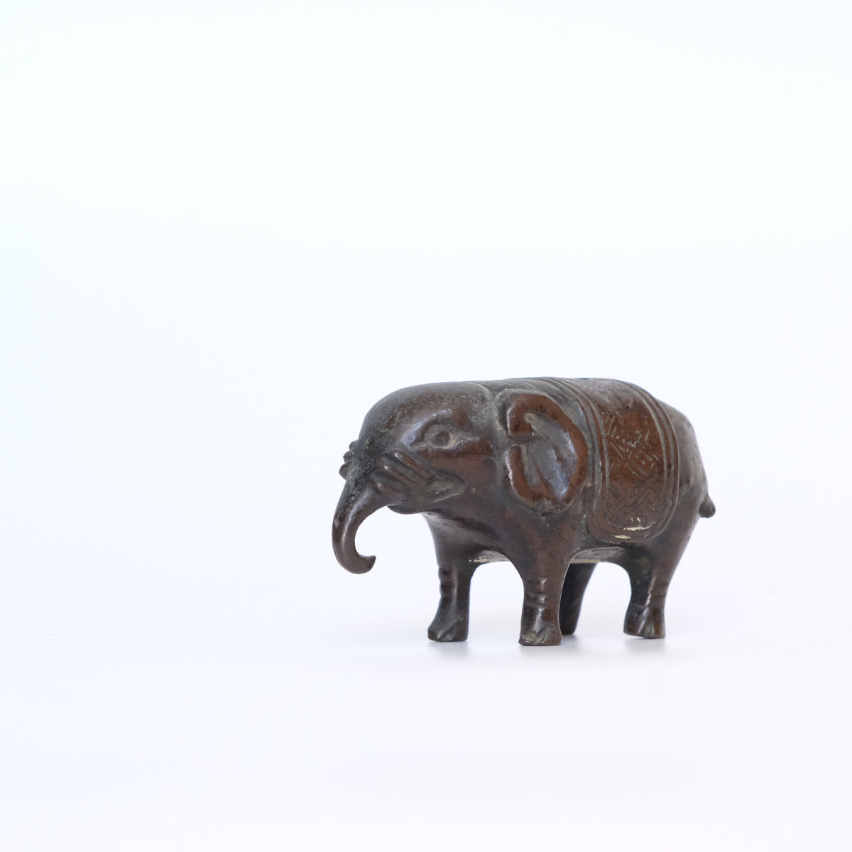 Small cast bronze elephant water dropper (suiteki) with incised caparison, view 1 of 8