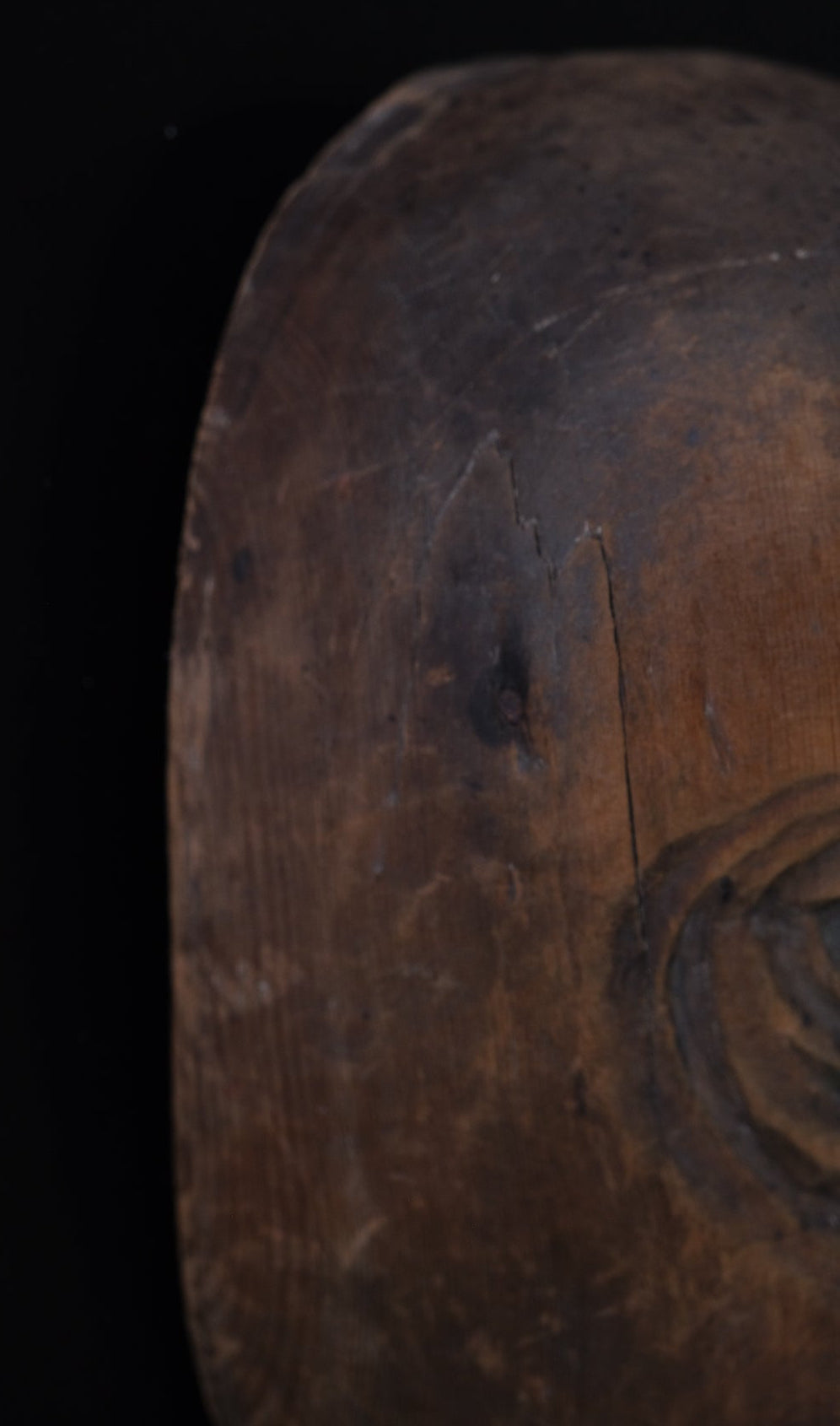 Hand-carved wooden monkey face mask mold with ringed eyes and a broad grin, view 7 of 8