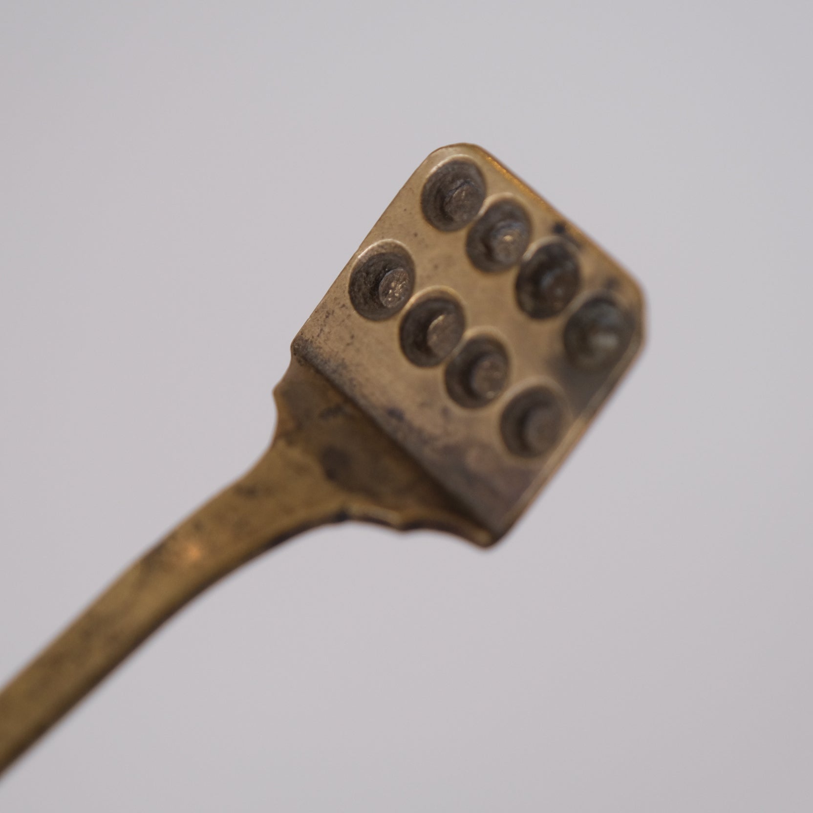 Detail of metal surface patina on Meiji period Japanese pill pressing form
