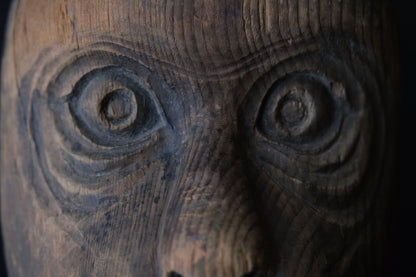 Hand-carved wooden monkey face mask mold with ringed eyes and a broad grin, view 6 of 8