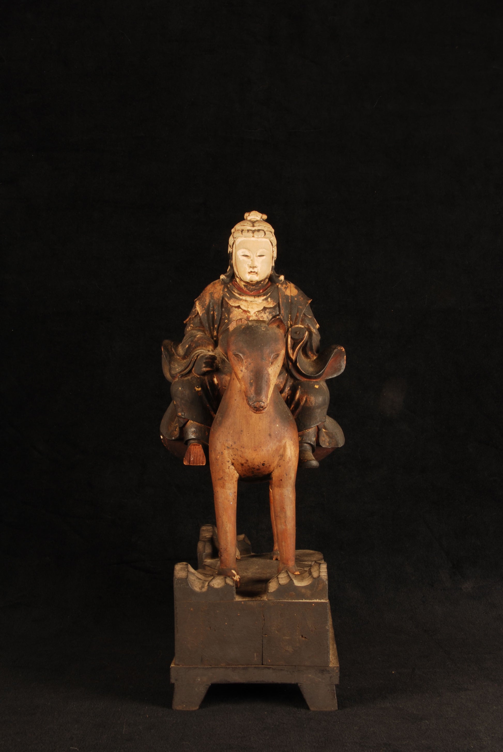 Close-up of painted polychrome losses on Edo period Inari god figure