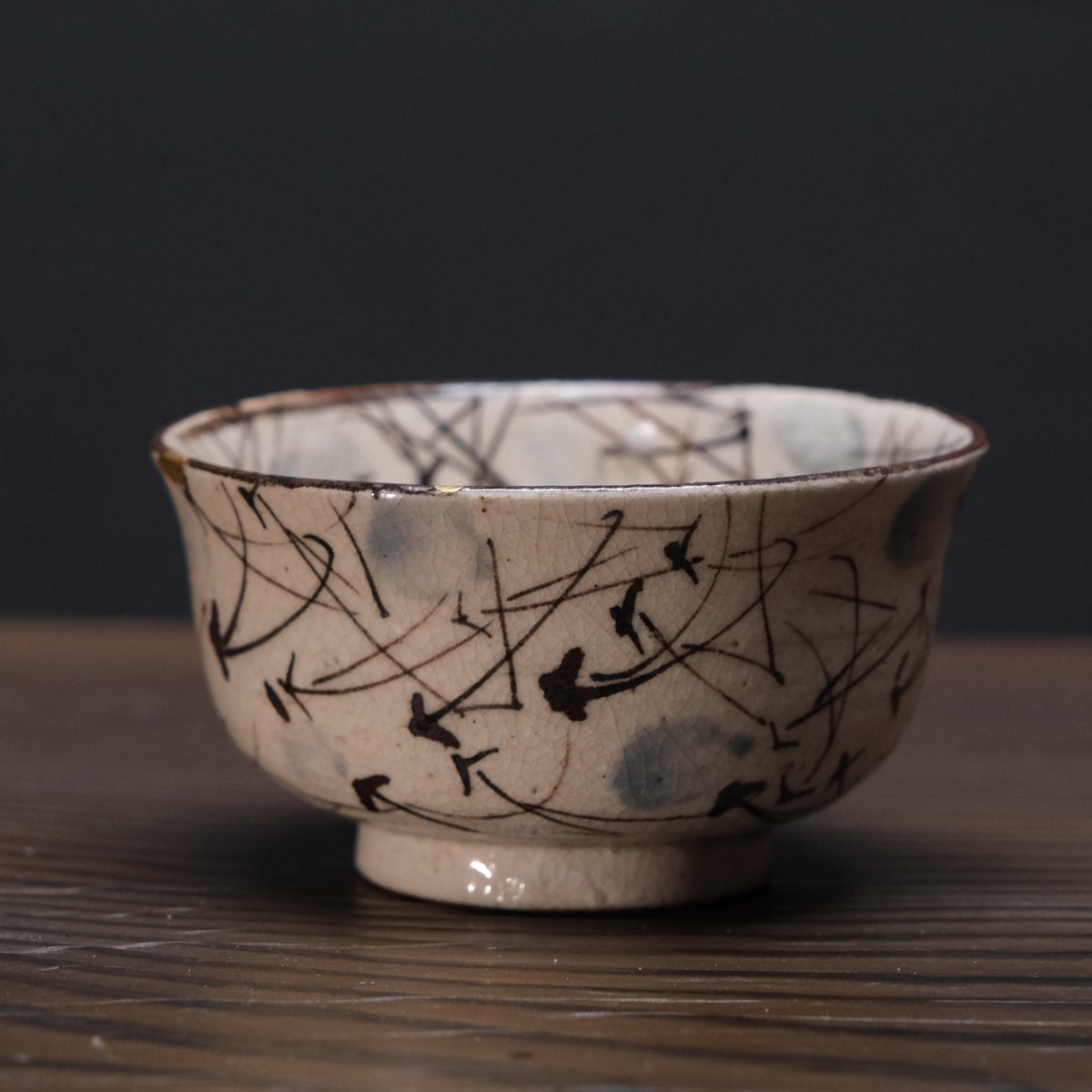 Kyo-yaki bowl with brushed susuki grass design and gold kintsugi repairs, view 1 of 10