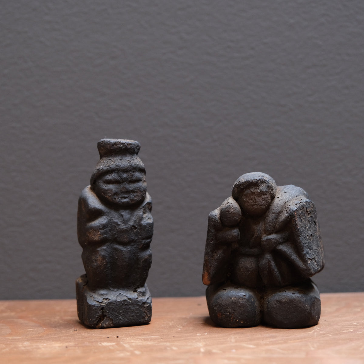 Pair of soot-darkened carved wood folk figures of Ebisu and Daikoku, view 1 of 8