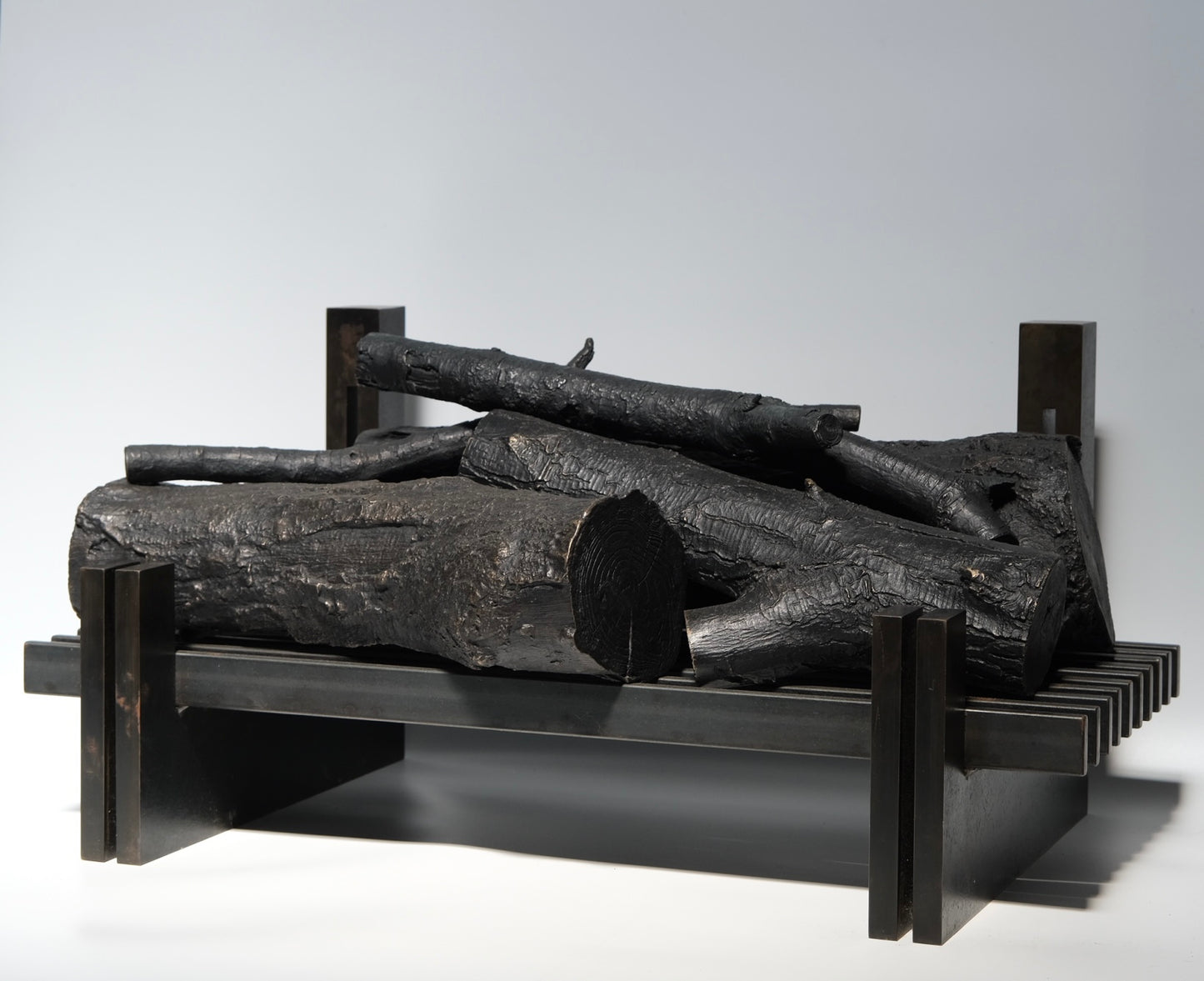 Bronze decorative logs detail showing casting and patina