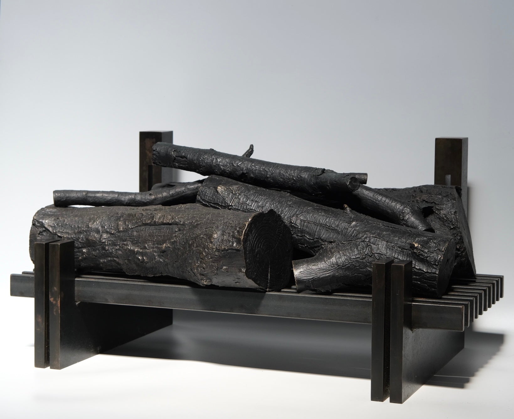 Bronze decorative logs detail showing casting and patina