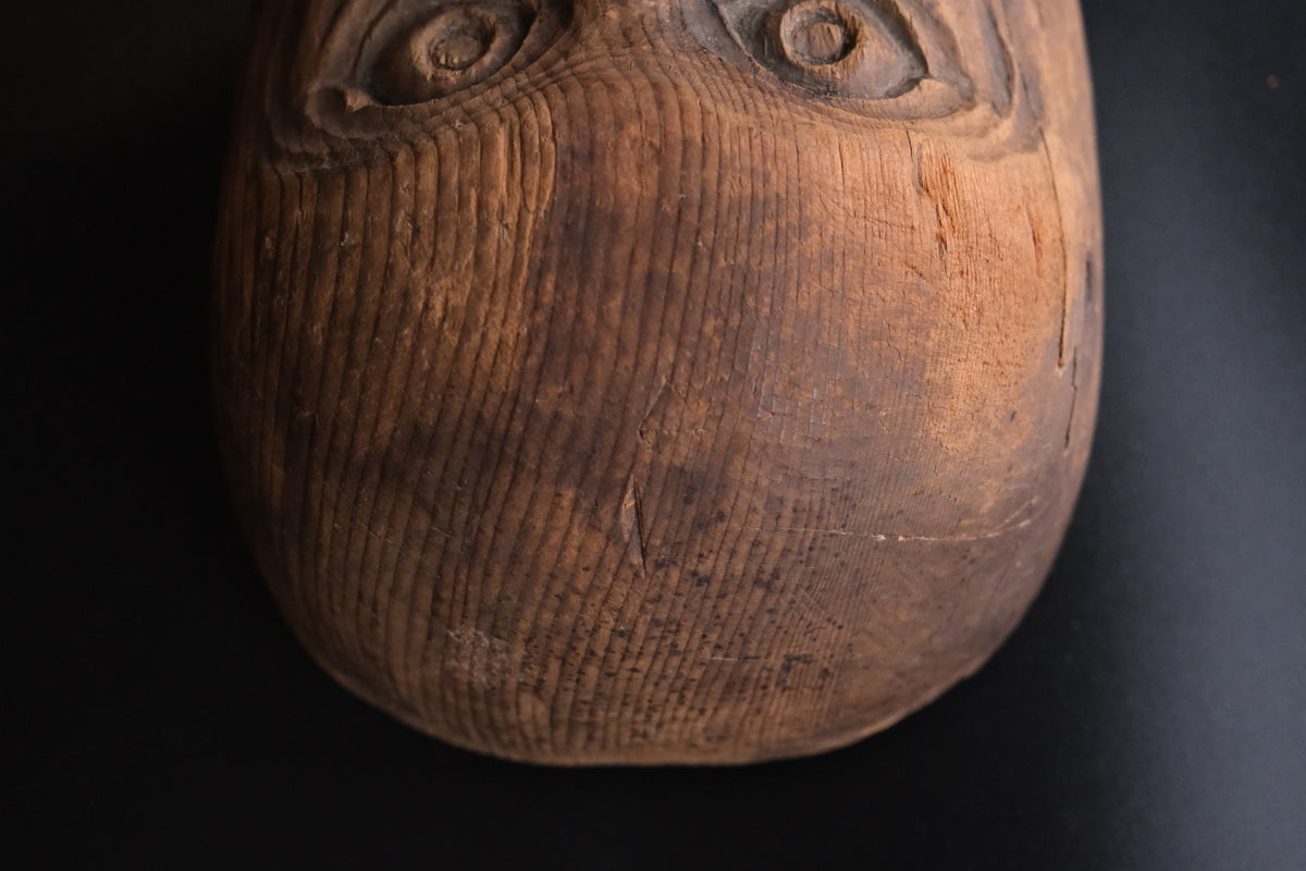 Hand-carved wooden monkey face mask mold with ringed eyes and a broad grin, view 8 of 8