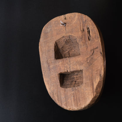 Hand-carved wooden monkey face mask mold with ringed eyes and a broad grin, view 2 of 8