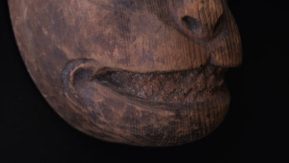 Hand-carved wooden monkey face mask mold with ringed eyes and a broad grin, view 5 of 8