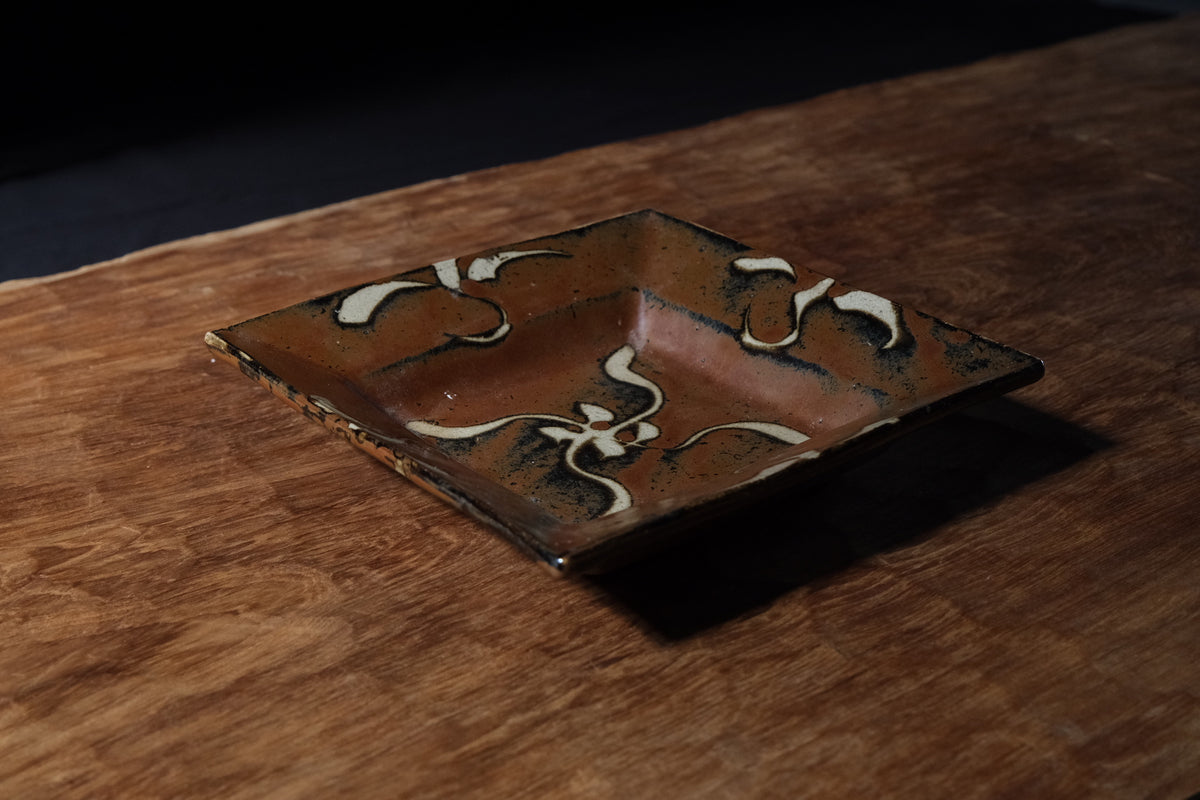 Shoji Hamada square stoneware dish with kaki glaze and wax-resist floral design, view 2 of 12
