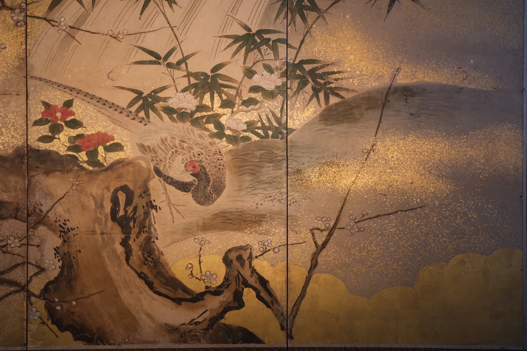 Close-up of plum tree blossoms on 19th century Kano school folding screen
