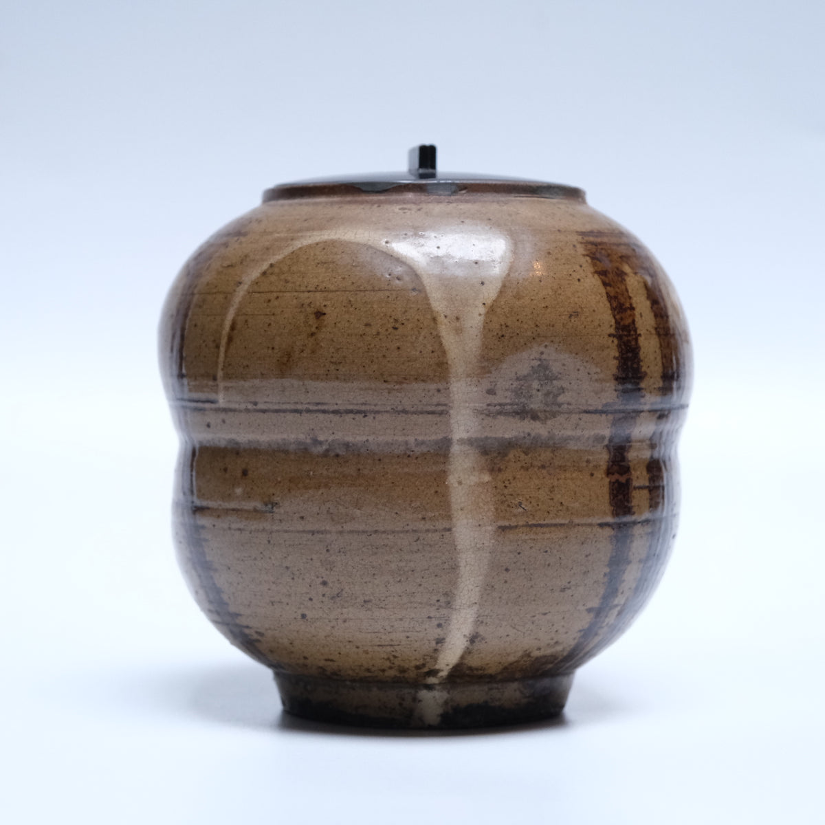 Edo period stoneware mizusashi (tea ceremony water jar) with trailing off-white and brown glazes and black lacquer lid, view 2 of 12