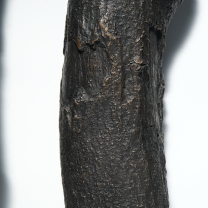 Bronze decorative log end detail showing casting quality