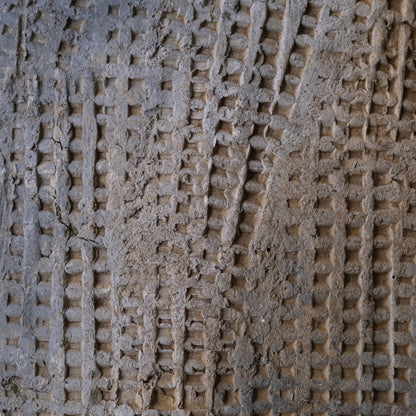 Heian-Kamakura period earthenware roof tile with impressed cord design, on a display stand, view 6 of 7