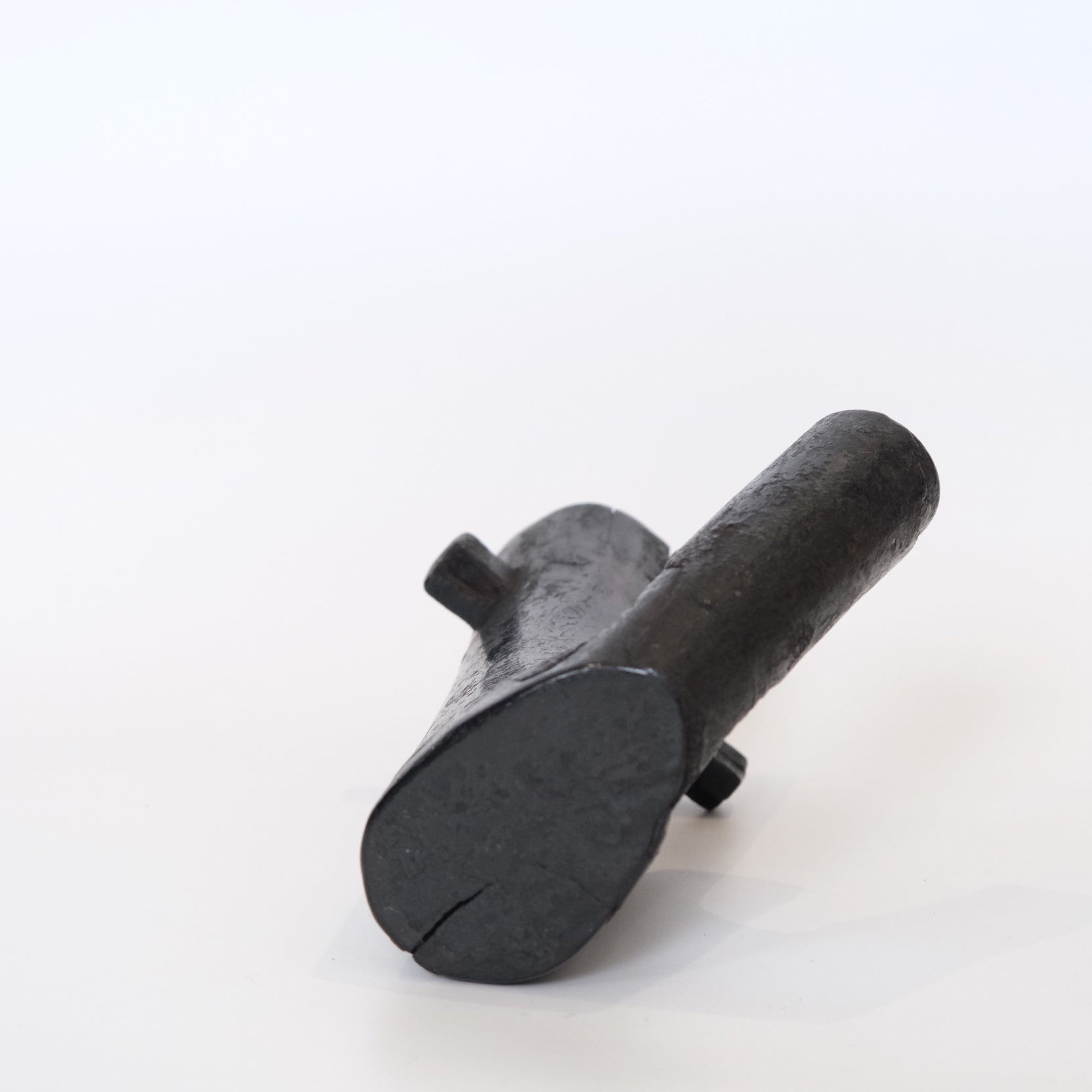Three-quarter view of Japanese mingei folk art hearth hook, well-patinated