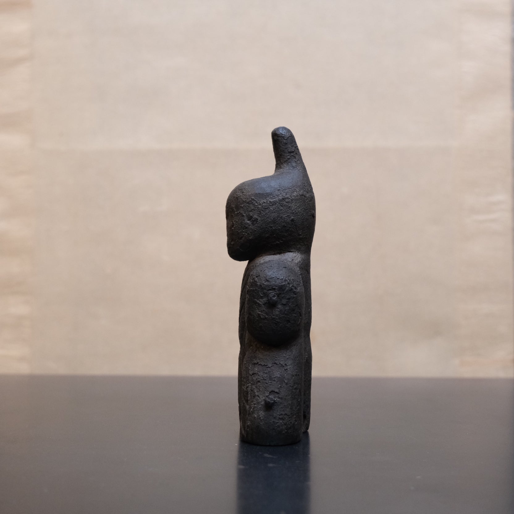 Detail of three interlocking carved wooden sections on Japanese shinzo figure