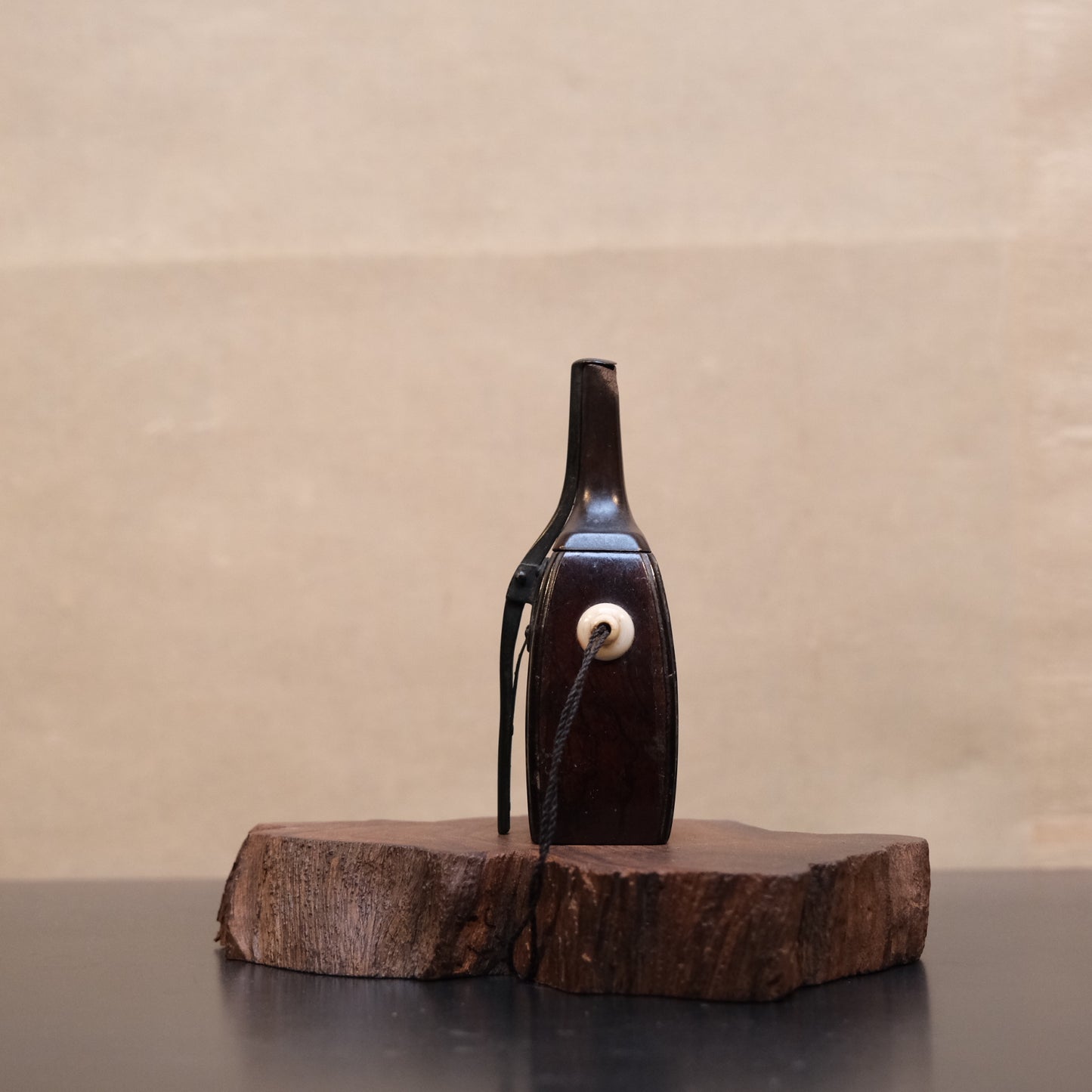 Detail of cord and bone hanging fitting on Japanese wooden gunpowder flask