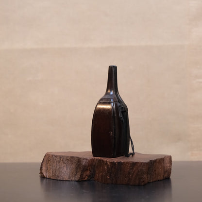Reverse of Japanese wooden gunpowder flask showing construction