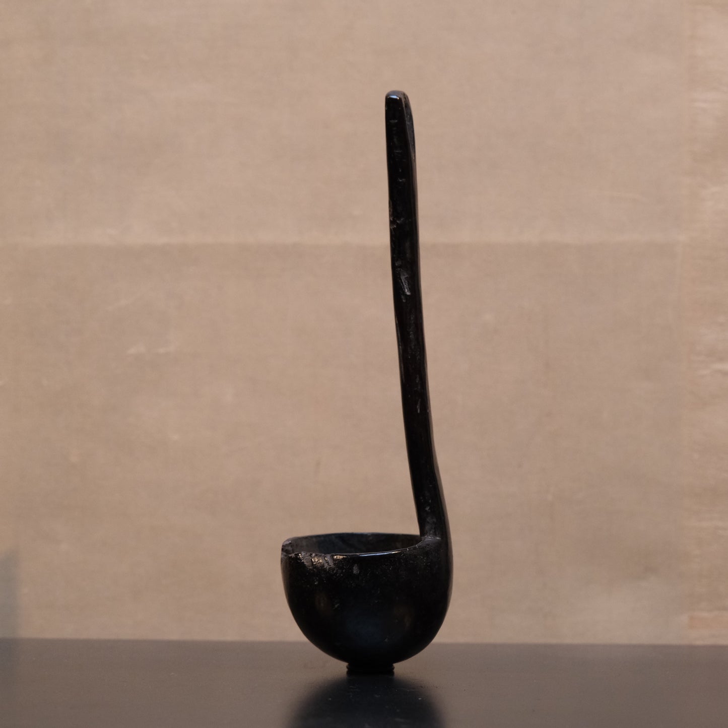 Philippine folk ladle side view showing carved handle and outstanding patina