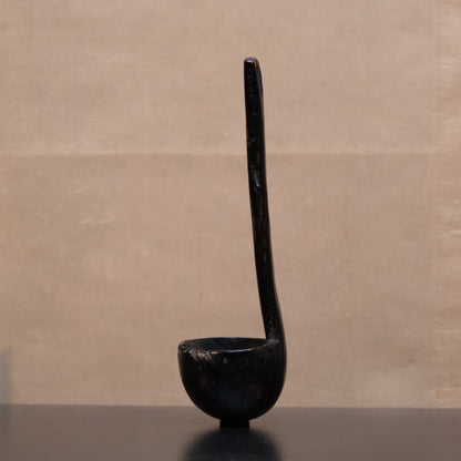 Philippine folk ladle side view showing carved handle and outstanding patina