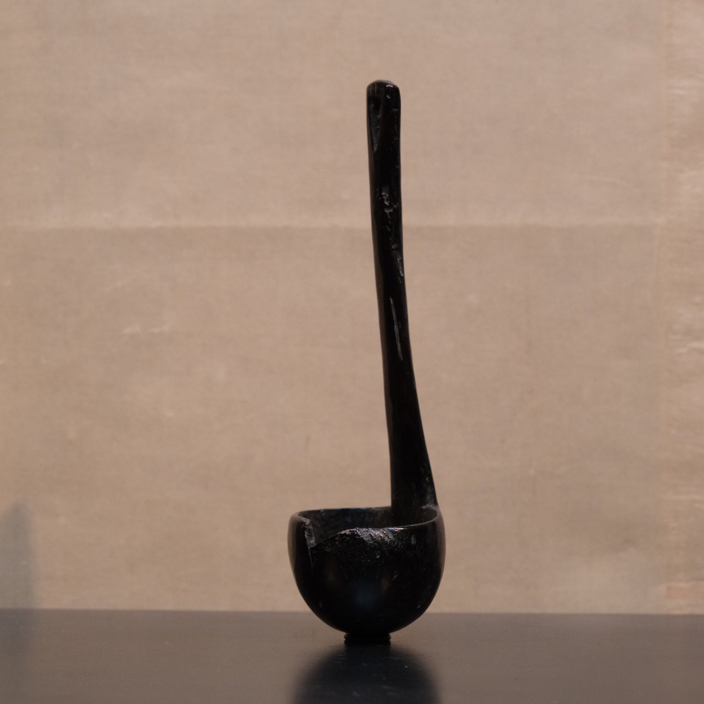 Close-up of wood grain and patina on old Philippine folk spoon ladle