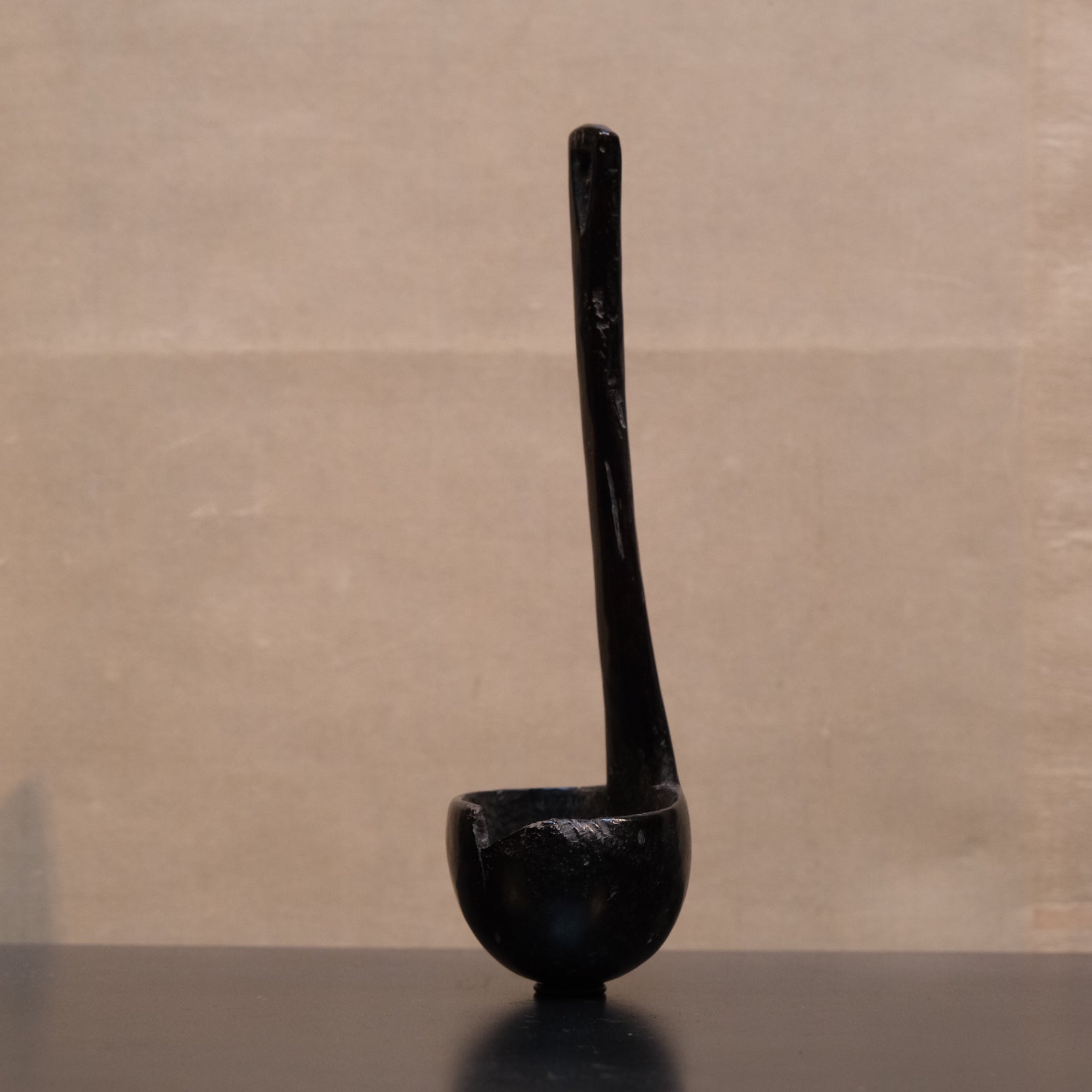 Close-up of wood grain and patina on old Philippine folk spoon ladle