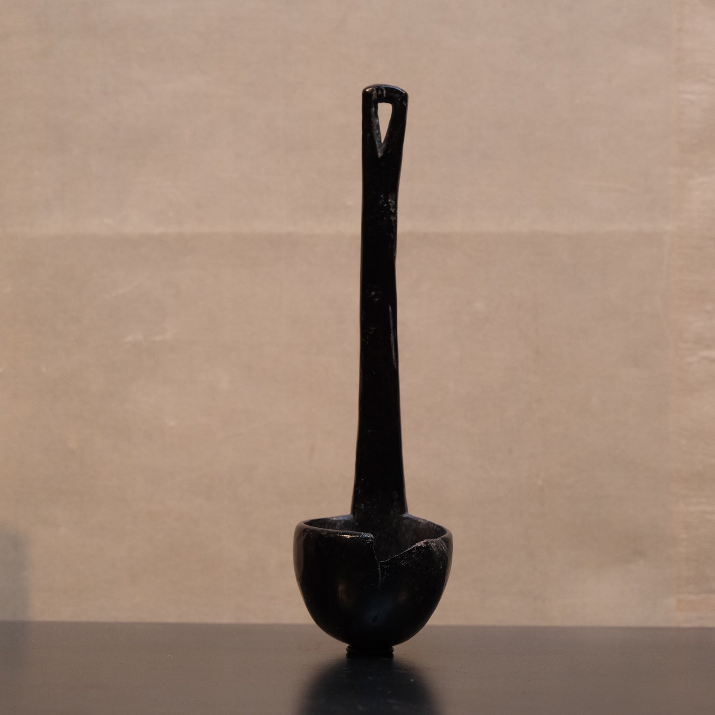 Detail of carved handle end on 10-inch Philippine folk ladle