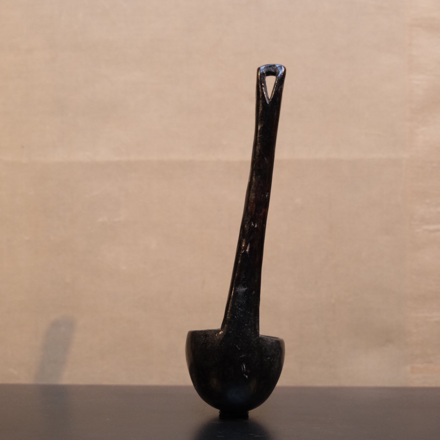 Reverse of Philippine folk spoon showing underside of carved bowl