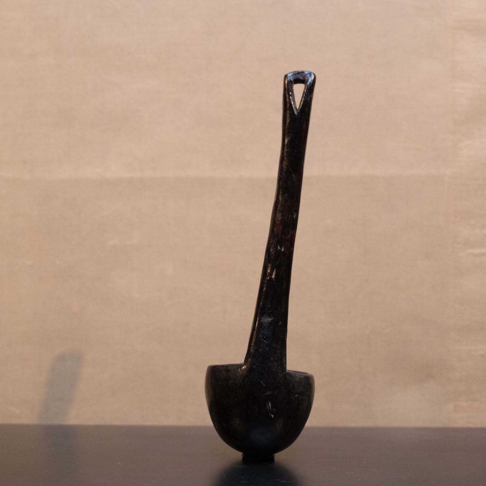 Reverse of Philippine folk spoon showing underside of carved bowl