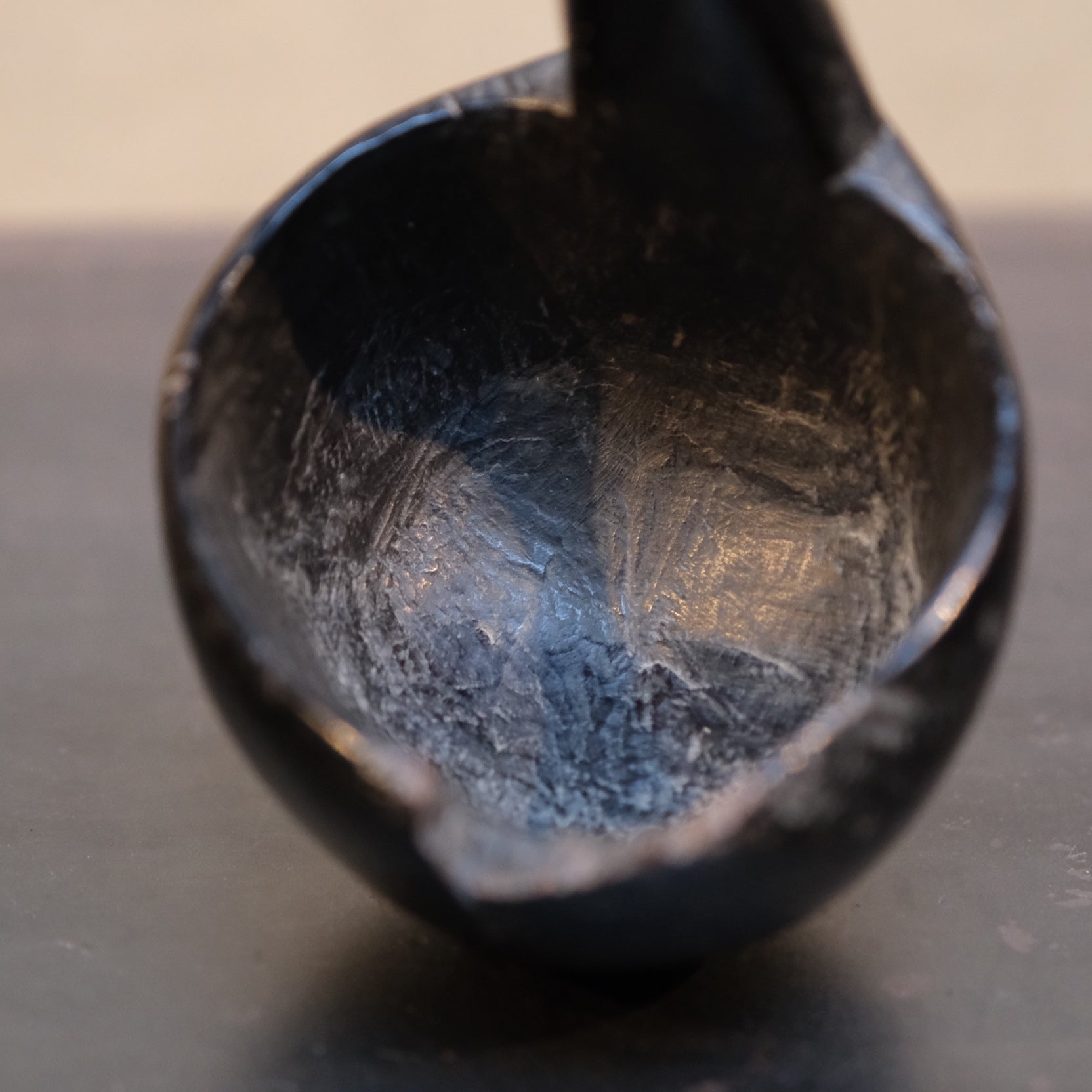 Side profile of Philippine folk ladle showing bowl depth