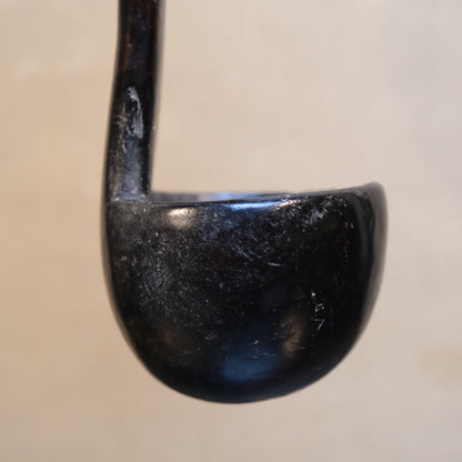 Alternate angle of Philippine folk spoon showing carved bowl construction