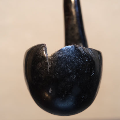 Detail of aged wood on Philippine folk ladle showing long use patina